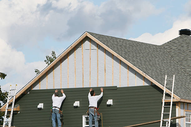 Professional Siding technician working in New Hyde Park, NY